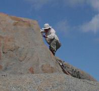 Ken scaling really steep boulder