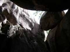 Boulder precariously wedged at the Baths